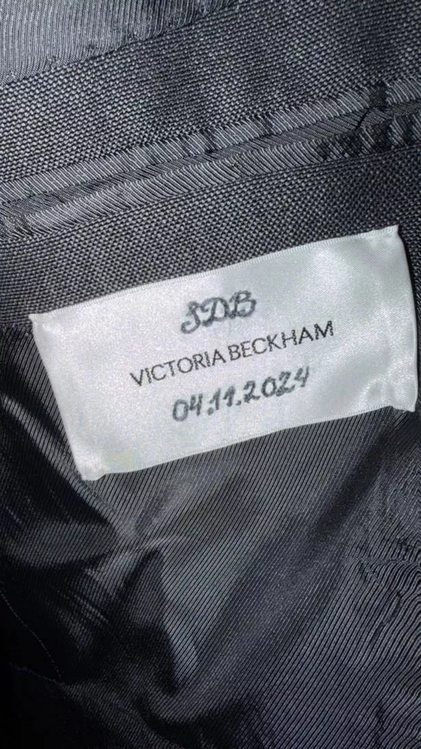 Victoria sews the wrong date on David's suit