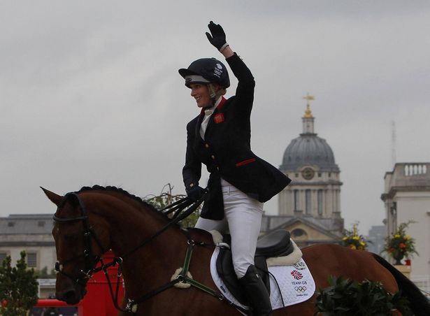 Great Britain's Zara Phillips celebrates on High Kingdom after competing in the Individual Eventing Jumping Final on day four of the London Olympic Games at Greenwich Park, London.