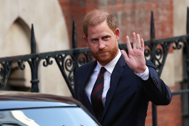 Duke of Sussex waves as he departs the the Royal Courts of Justice