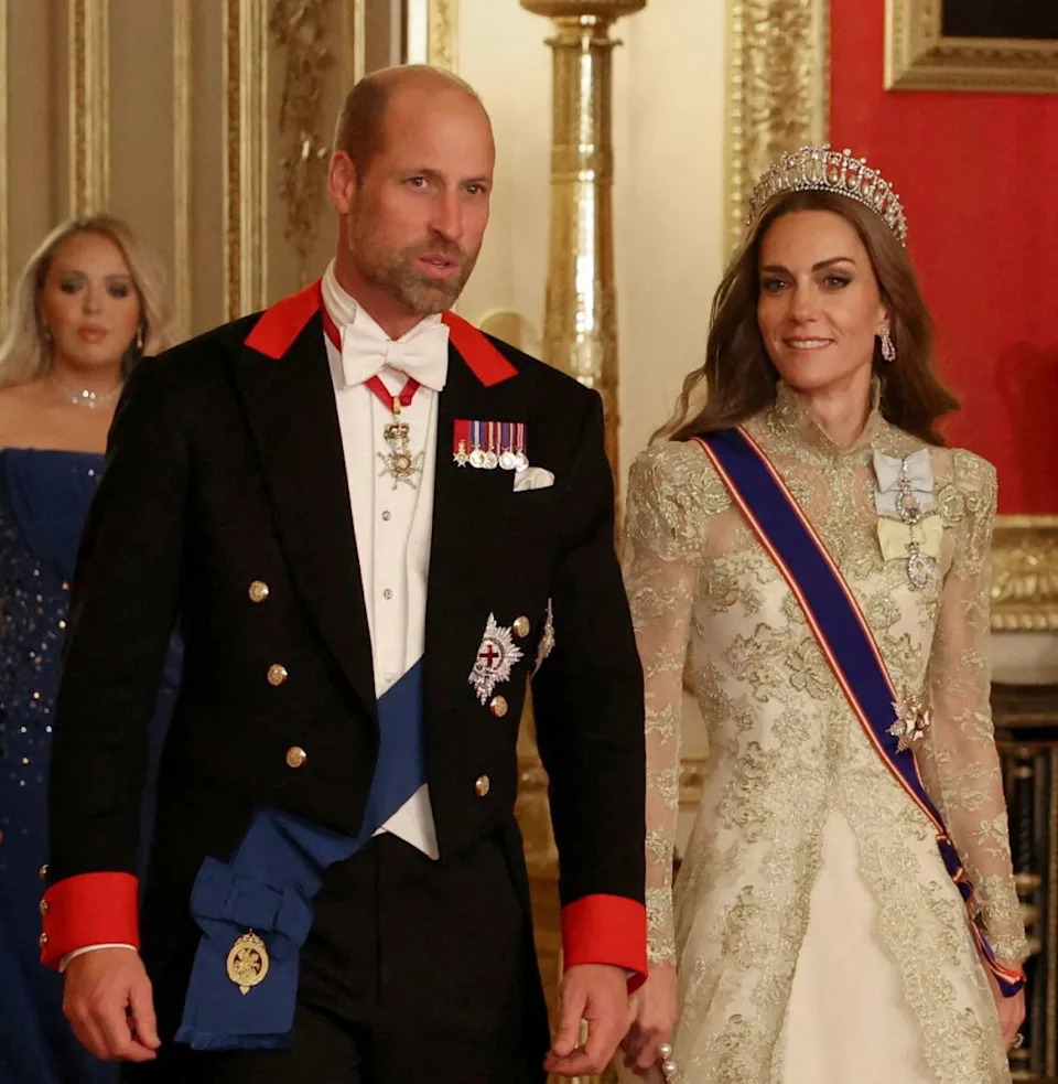  Prince William in a uniform and Princess Kate wearing a gold gown at US state visit . 