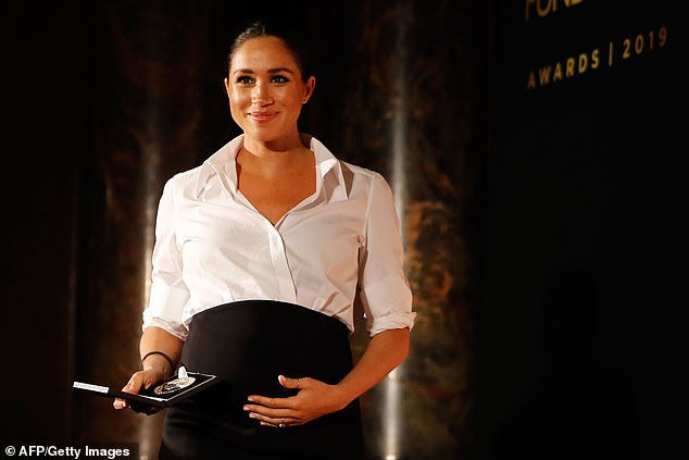 The duchess demonstrated the versatility of her fashion failsafe at the Endeavour Fund Awards in 2019. Tucking a cross over Givenchy button-down into a black maxi skirt, Meghan took classic work attire into glamorous evening wear territory