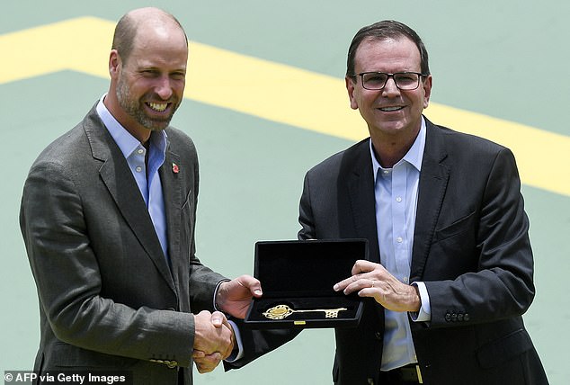 The Prince of Wales receives the keys to the city from Rio de Janeiro's mayor Eduardo Paes during the 'Welcome to Brazil' event at Sugarloaf Mountain