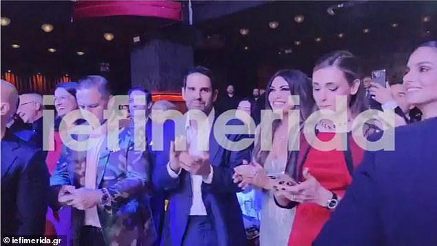 Sharing her table was billionaire Eric Vassilatos, whose private jet had whisked her to Greece earlier in the week, along with a few more people among her inner circle