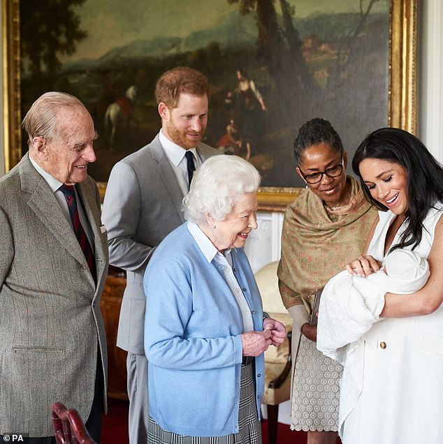 The Duchess of Sussex with her mother Doria Ragland and Prince Harry as she held her then-newborn son Archie during a meeting with the late Prince Philip and Queen Elizabeth