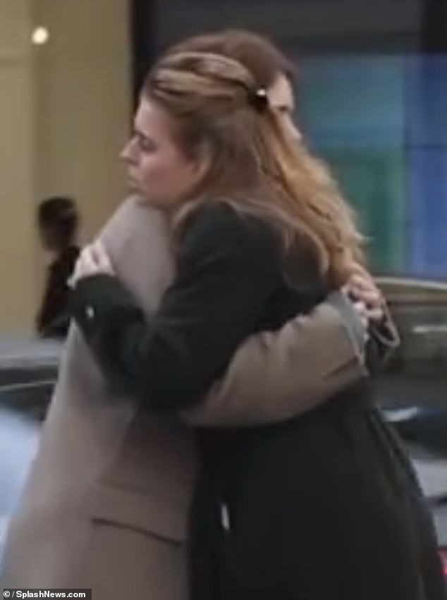 Princesses Beatrice and Eugenie were spotted hugging on Thursday after a week where their father has also been taken off the Roll of the Peerage