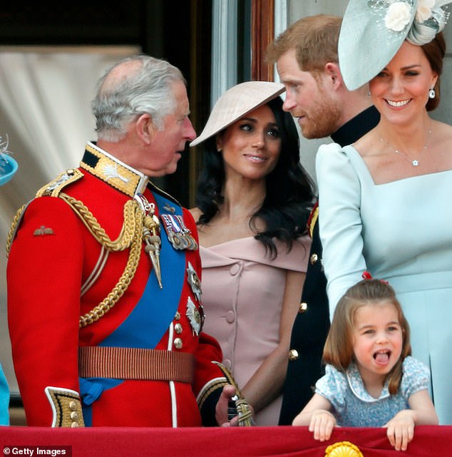 At the time, it was reported that the newlyweds, along with Charles and Camilla, went for long walks, enjoyed 'good food and quality family time' at the Queen Mother's beloved former Scottish residence. Prince Harry and Meghan with King Charles (left) during Trooping the Colour in June 2018 - with then-Duchess of Cambridge (right) with her daughter, Princess Charlotte