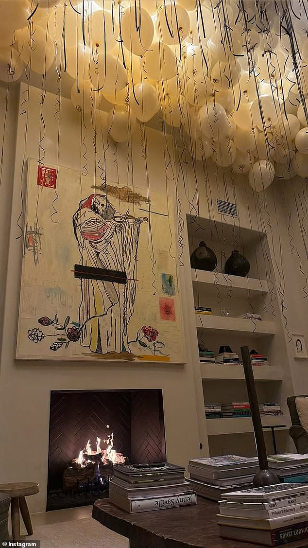 There were also countless white balloons with black string floating under the ceiling of the home