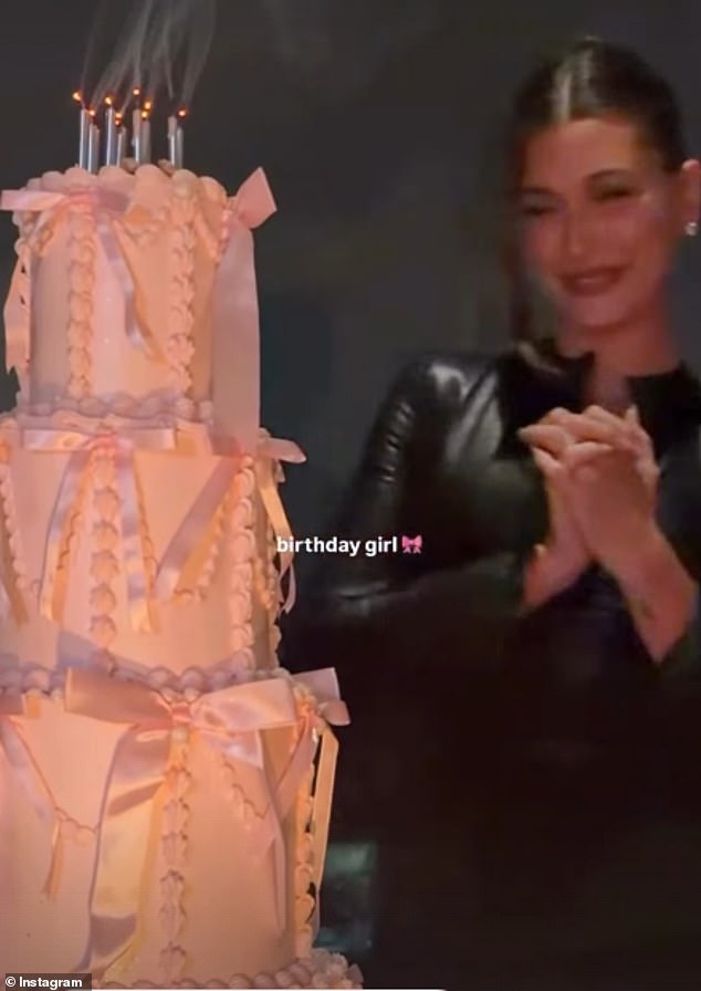 After the celebration began, Hailey flashed a big smile as she blew out candles on a five-tier cake