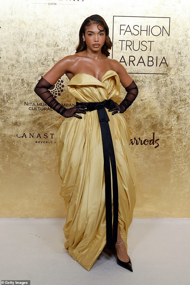 Lori Harvey wore a ruffled gold dress