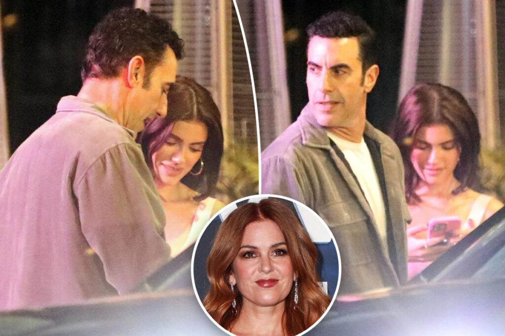 Sacha Baron Cohen cozies up to influencer half his age for club outing