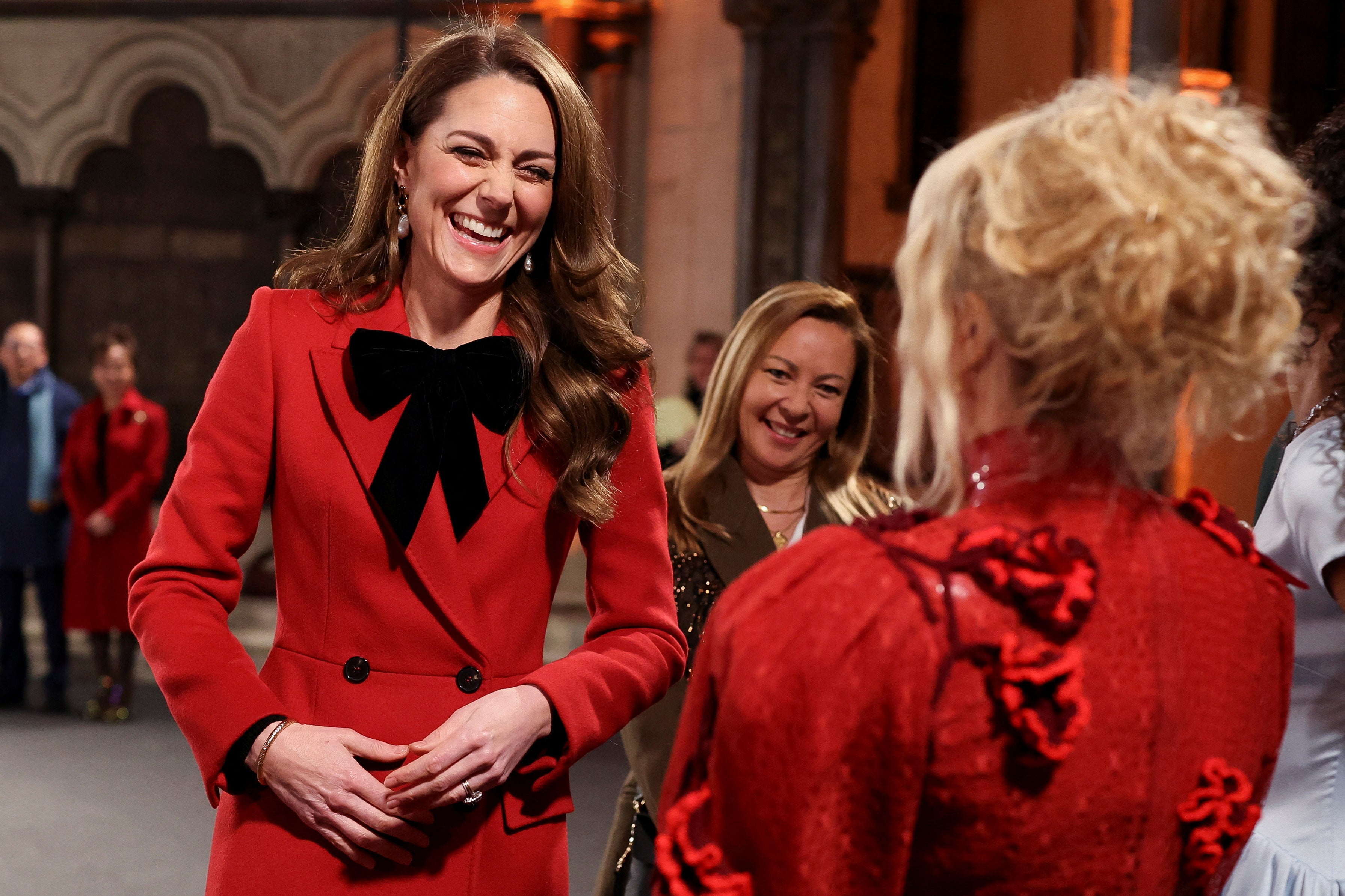 The Princess of Wales laughs with Paloma Faith at the 2024 Together At Christmas carol service in Westminster Abbey