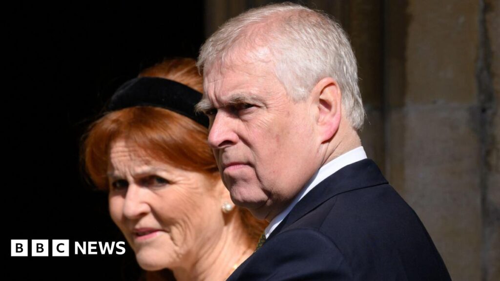 A file photo from the 2025 Easter Service at St George's Chapel in Windsor of the then-Prince Andrew, wearing a dark suit and pictured in a three-quarter view, with Sarah Ferguson, who has a black Alice band in her hair, standing behind him.
