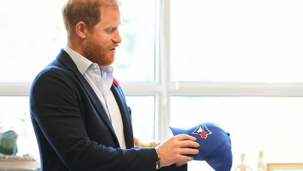Prince Harry jokes he was ‘under duress’ while wearing Dodgers cap at World Series Prince Harry jokes he was 'under duress' while wearing Dodgers cap at World Series