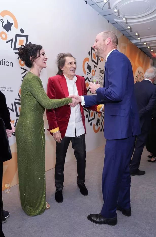The Prince of Wales greets Sally Wood as he arrives for the Tusk Conservation Awards