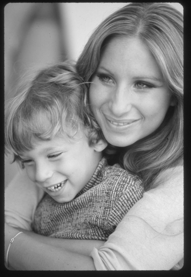 Jason Gould as a kid with his mum barbara streisand both smiling in black and white shot