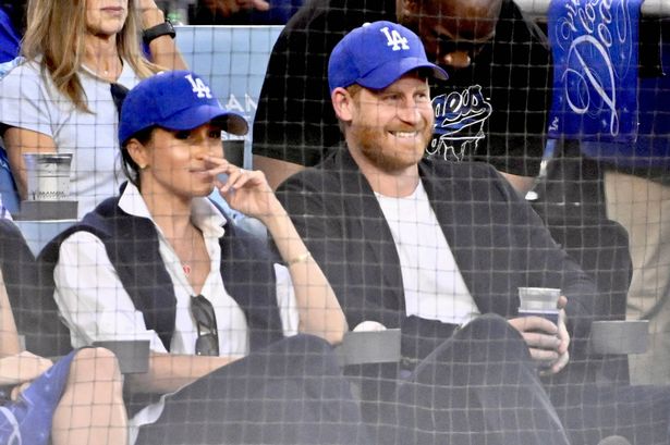 Los Angeles, CA - October 28:  Prince Harry and Meghan Markle look on in the second inning of Game 4 of a World Series Baseball game between the Toronto Blue Jays and Los Angeles Dodgers at Dodger Stadium in Los Angeles on Tuesday, October 28, 2025. (Photo by Keith Birmingham/MediaNews Group/Pasadena Star-News via Getty Images)