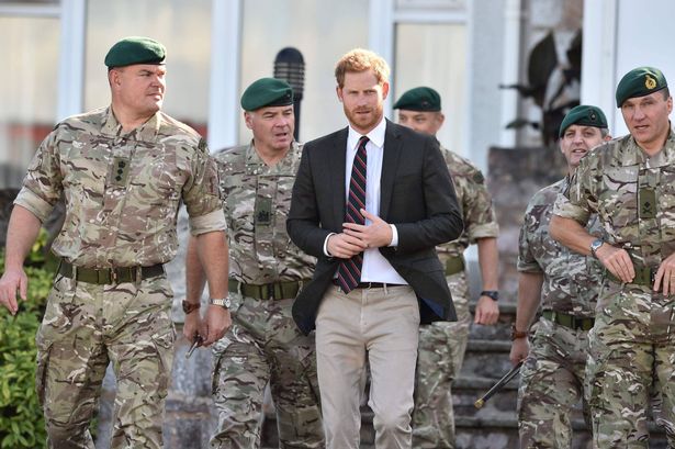 The Duke of Sussex makes his way from the officers’ mess during a visit to the Royal Marines Commando Training Centre in Lympstone, Devon