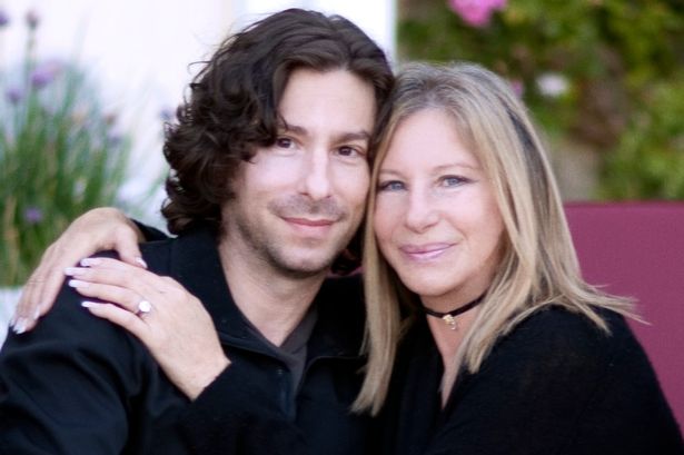 Jason Gould with mum Barbra streisand's arm around him