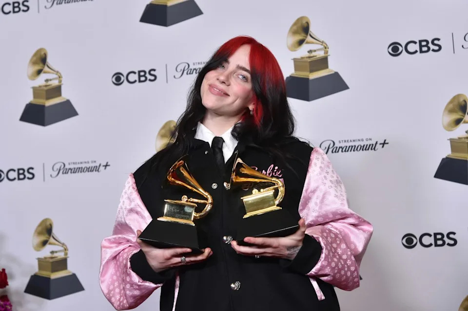 Billie Eilish poses in the press room with the awards for best song written for visual media and song of the year for "What Was I Made For?" from "Barbie the Album" during the 66th annual Grammy Awards on Sunday, Feb. 4, 2024, in Los Angeles. (Photo by Richard Shotwell/Invision/AP)