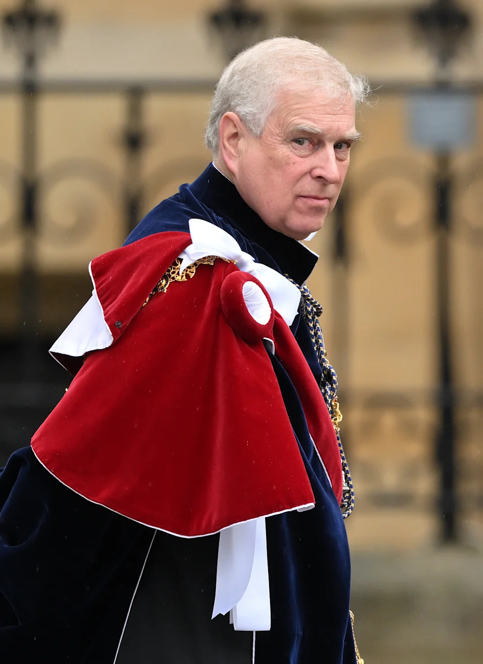 Andrew Mountbatten-Windsor wearing a velvet cape on King Charles's coronation day