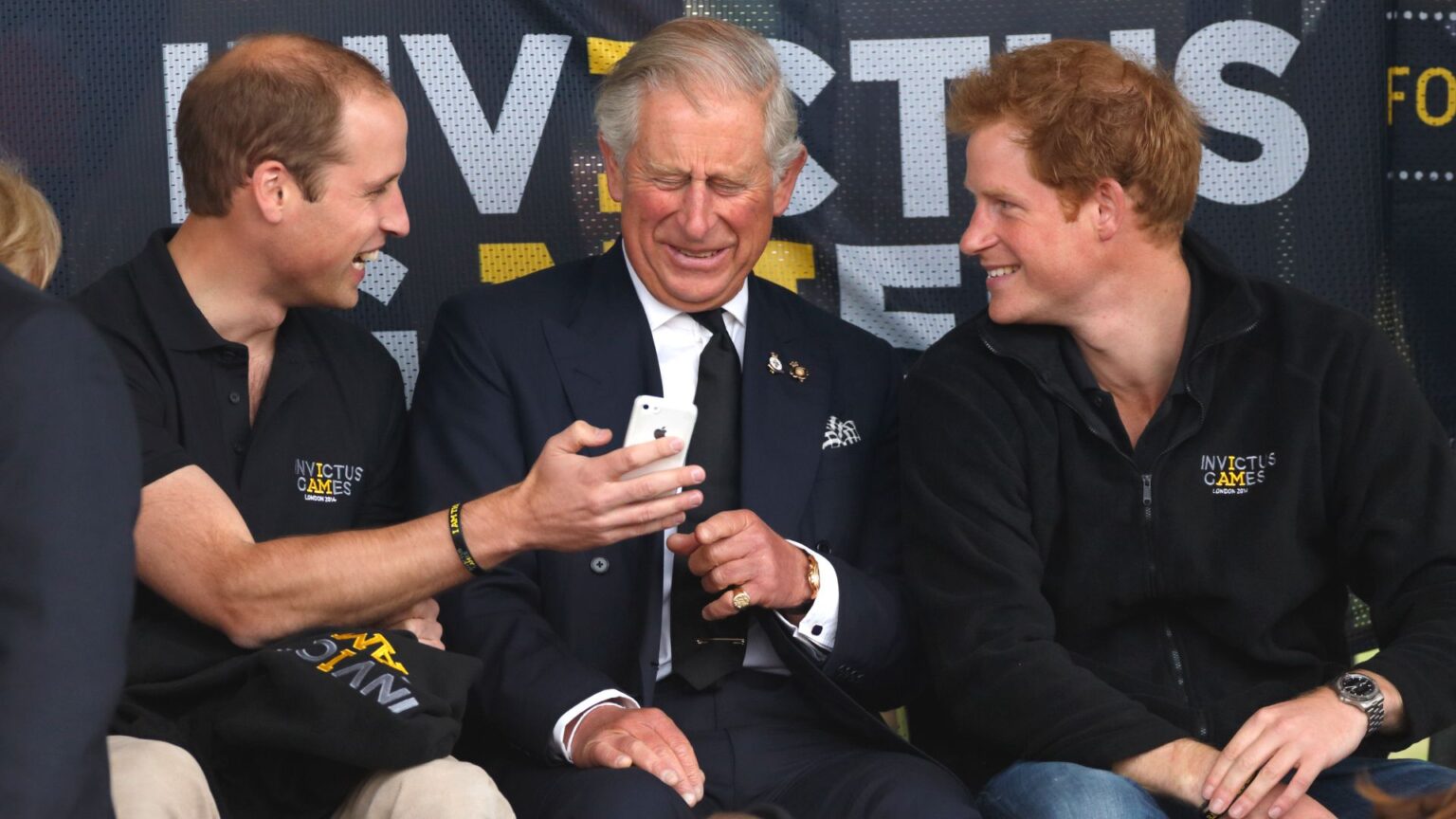 The One “Depressing” Parenting Choice All Members of the Royal Family Seem to Agree On Prince William, Prince Harry, King Charles using an iPhone