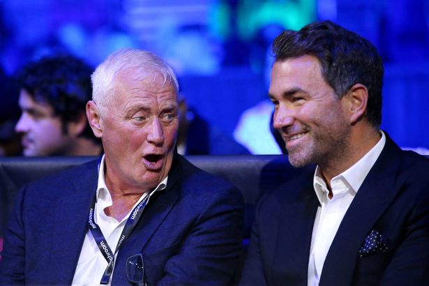 Promotor, Eddie Hearn (R) and his father Barry Hearn watch on at AO Arena on April 16, 2022