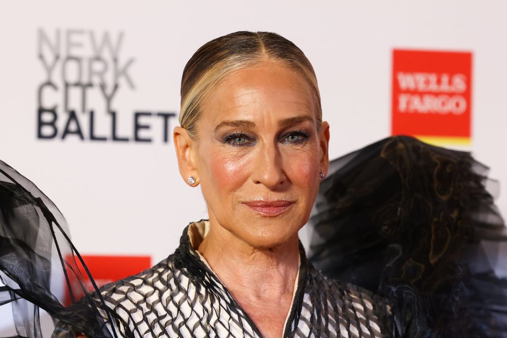 Sarah Jessica Parker clsoe up in black gown with hair slicked back