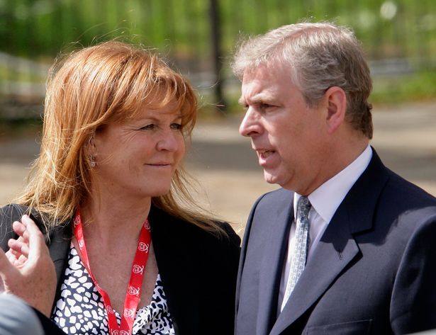 Sarah Ferguson talks with ex-husband Prince Andrew as they wait for daughter HRH Princess Beatrice of York to complete the Virgin London Marathon