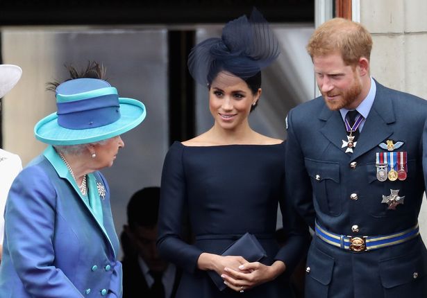 Meghan and Harry with the late Queen