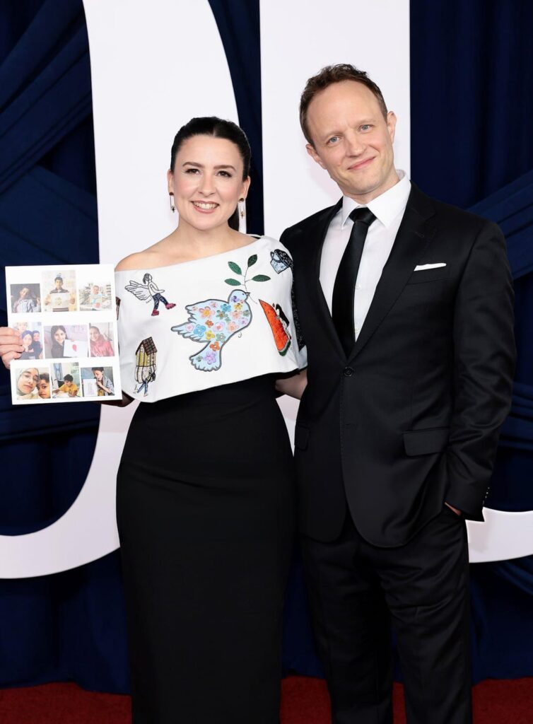 Ms Rachel, who's one of tonight's honorees, wears her heart on her sleeves with a dress dedicated to Palestine while at Glamour's Women of the Year Awards in NYC. She asked children from Gaza to make artwork that told their stories, and then had their pictures embroidered onto the upcycled dress.