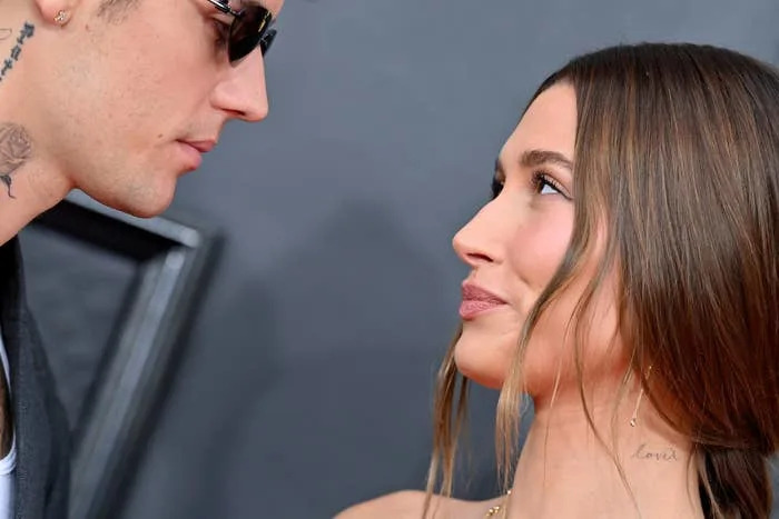 Hailey Bieber looks at Justin Bieber on the red carpet