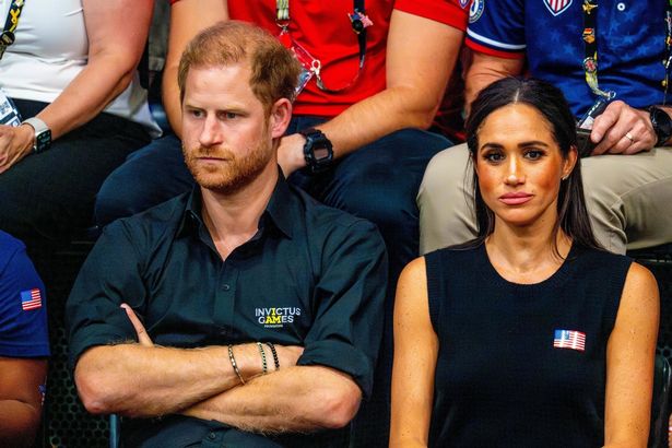 Meghan and Harry watching sport