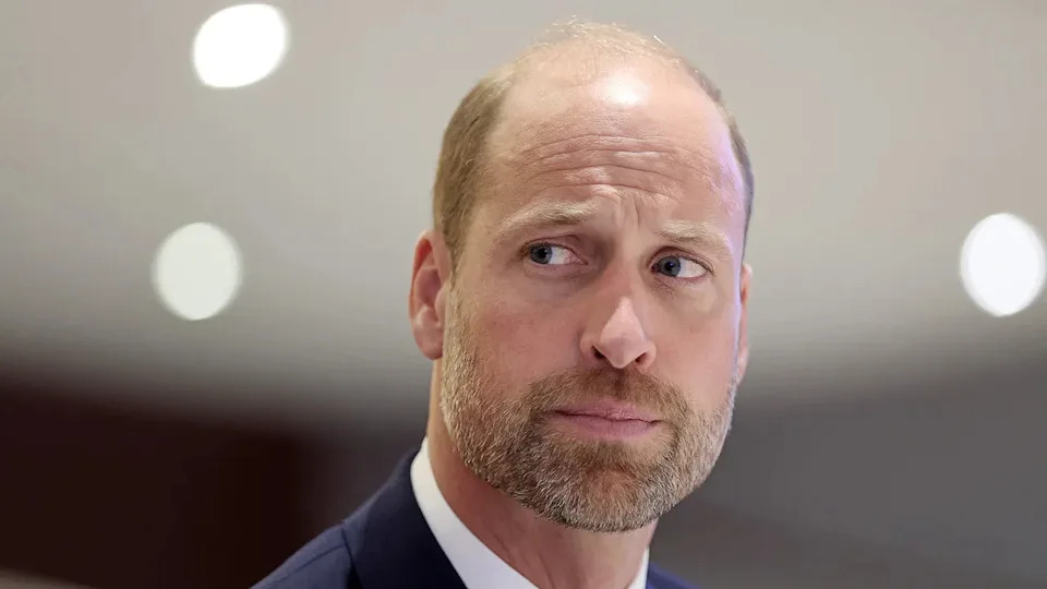 A close-up of Prince William looking annoyed and pensive.