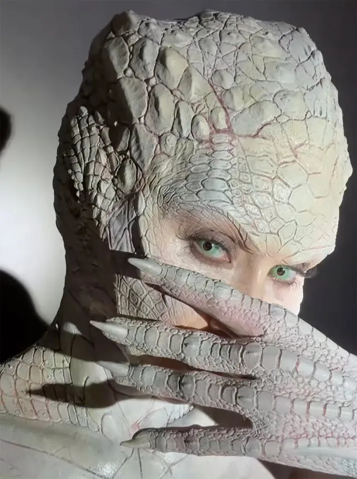 Kim Kardashian/Instagram Kim Kardashian dressed up as an albino alligator for Halloween 2024