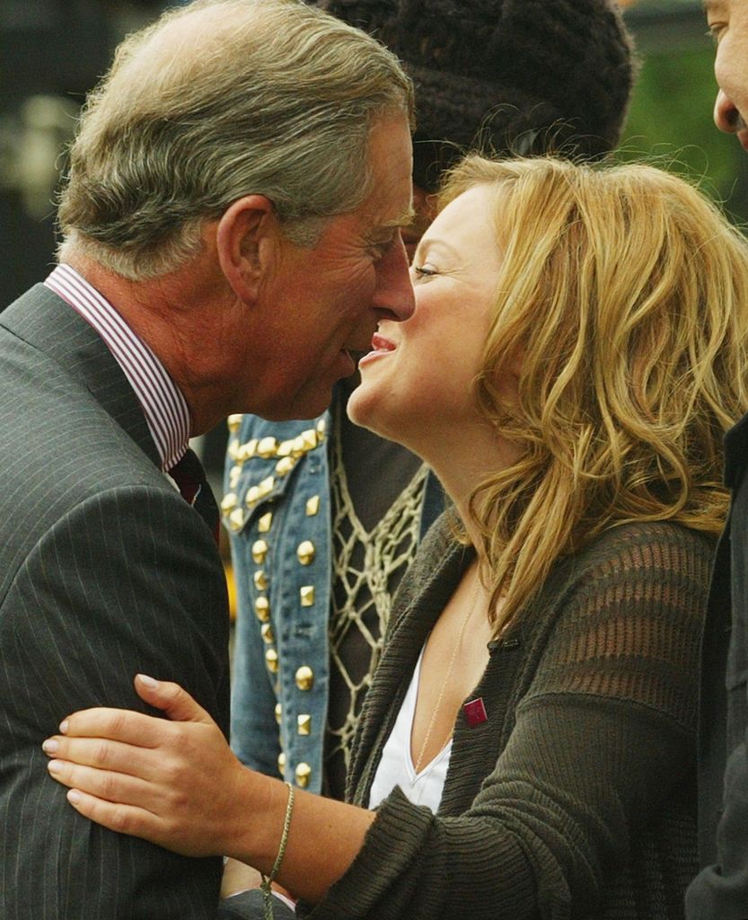 Prince Charles is embraced by former Spice Girl Geri Halliwell at '95.8 Capital FM's Party In The Park For The Prince's Trust' at Hyde Park on July 11, 2004 