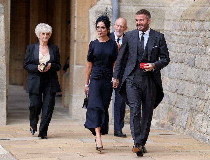 Sir David Beckham with his wife, Lady Victoria, and parents -- Ted and Sandra -- after he was made a knight at an investiture ceremony at Windsor Castle. 