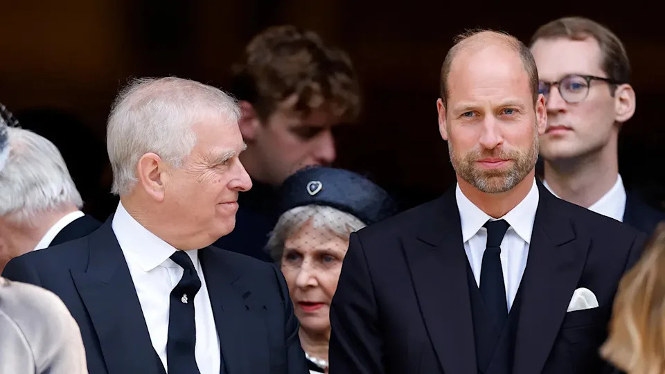 Prince Andrew smirking at Prince William as the Prince of Wales looks on.