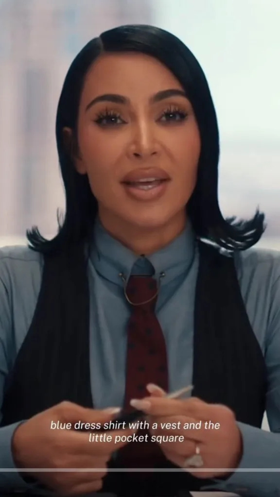 The outfit also included a blue-collared shirt, a dark-colored vest and a burgundy tie. Hulu