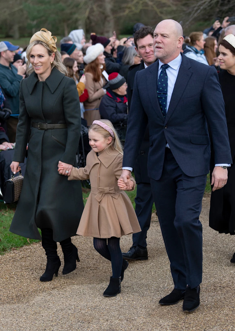 Zara Tindall wearing a green coat holding hands with Lena Tindall on Christmas morning 2023