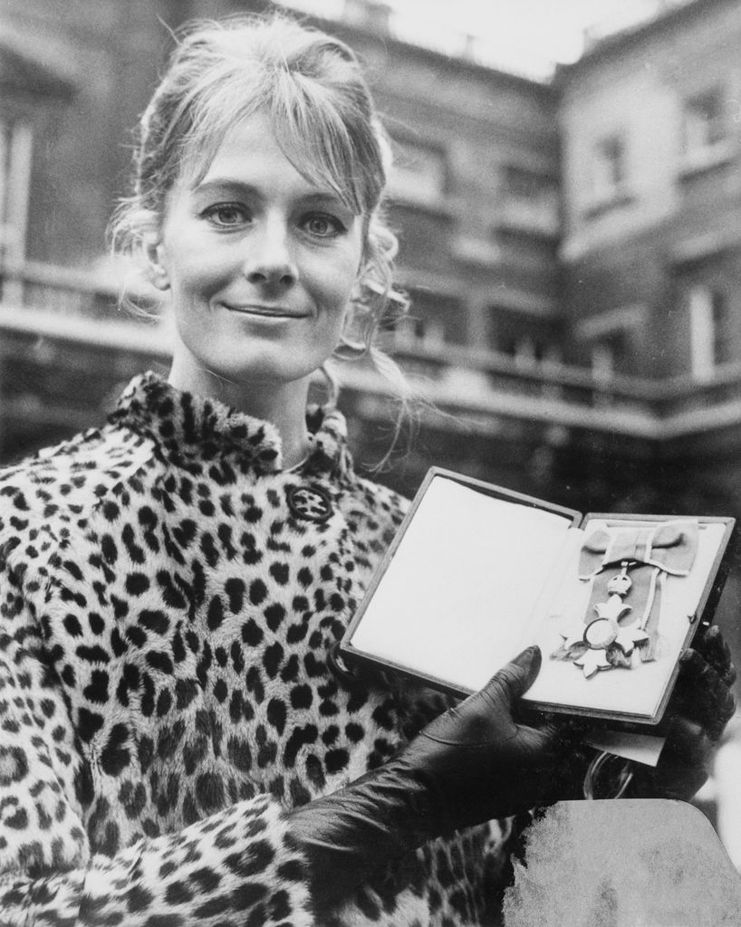 Seen leaving Buckingham Palace is actress Vanessa Redgrave, holding the C.B.E. (Commander of the British Empire), which she was awarded at the Feb. 13 investiture. She is the second member of the famous acting family to be honored at Buckingham Palace. Her father was knighted there in 1959.