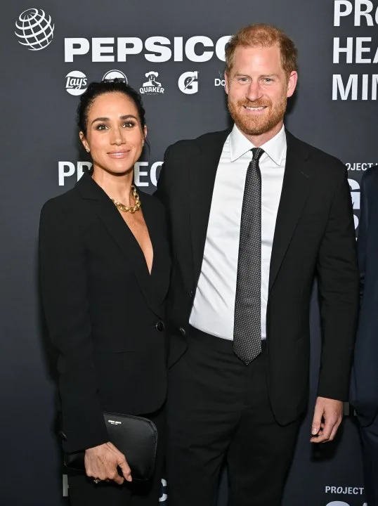 Meghan Markle, left, and Prince Harry, The Duke and Duchess of Sussex, attend the third annual World Mental Health Day Gala, hosted by Project Healthy Minds, at Spring Studios on Thursday, Oct. 9, 2025, in New York. (Photo by Evan Agostini/Invision/AP)