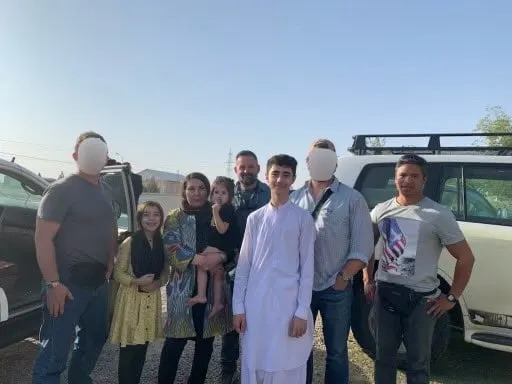 Cory Mills, center with beard, was pictured at the mission's conclusion, despite reportedly being ditched by his crew. / Ronny Jackson/X