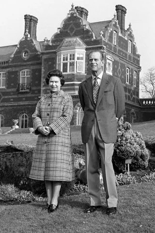 Ron Bell/PA Images via Getty Queen Elizabeth II and Prince Philip on the grounds of Sandringham House.