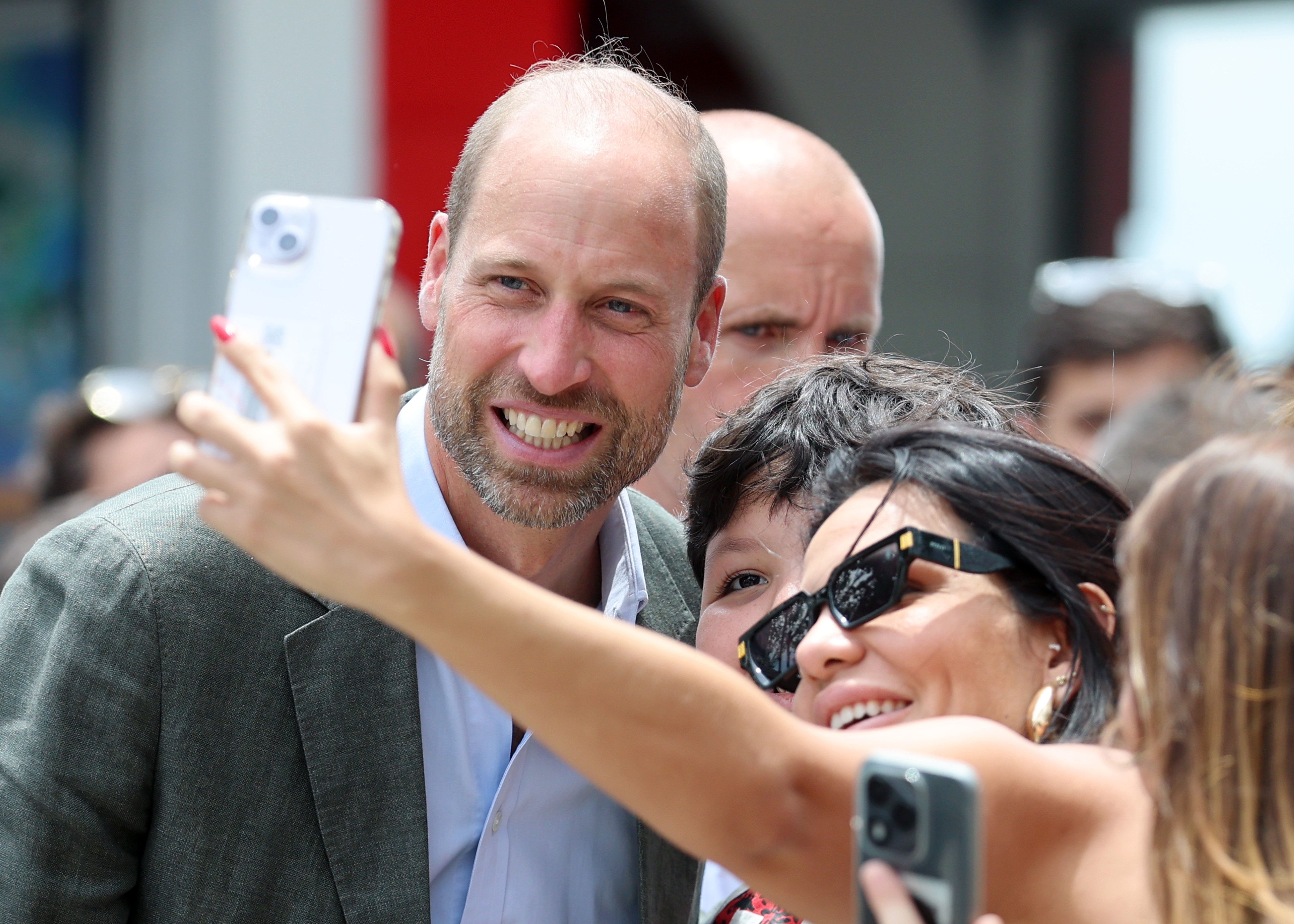 Prince William taking a selfie with a woman