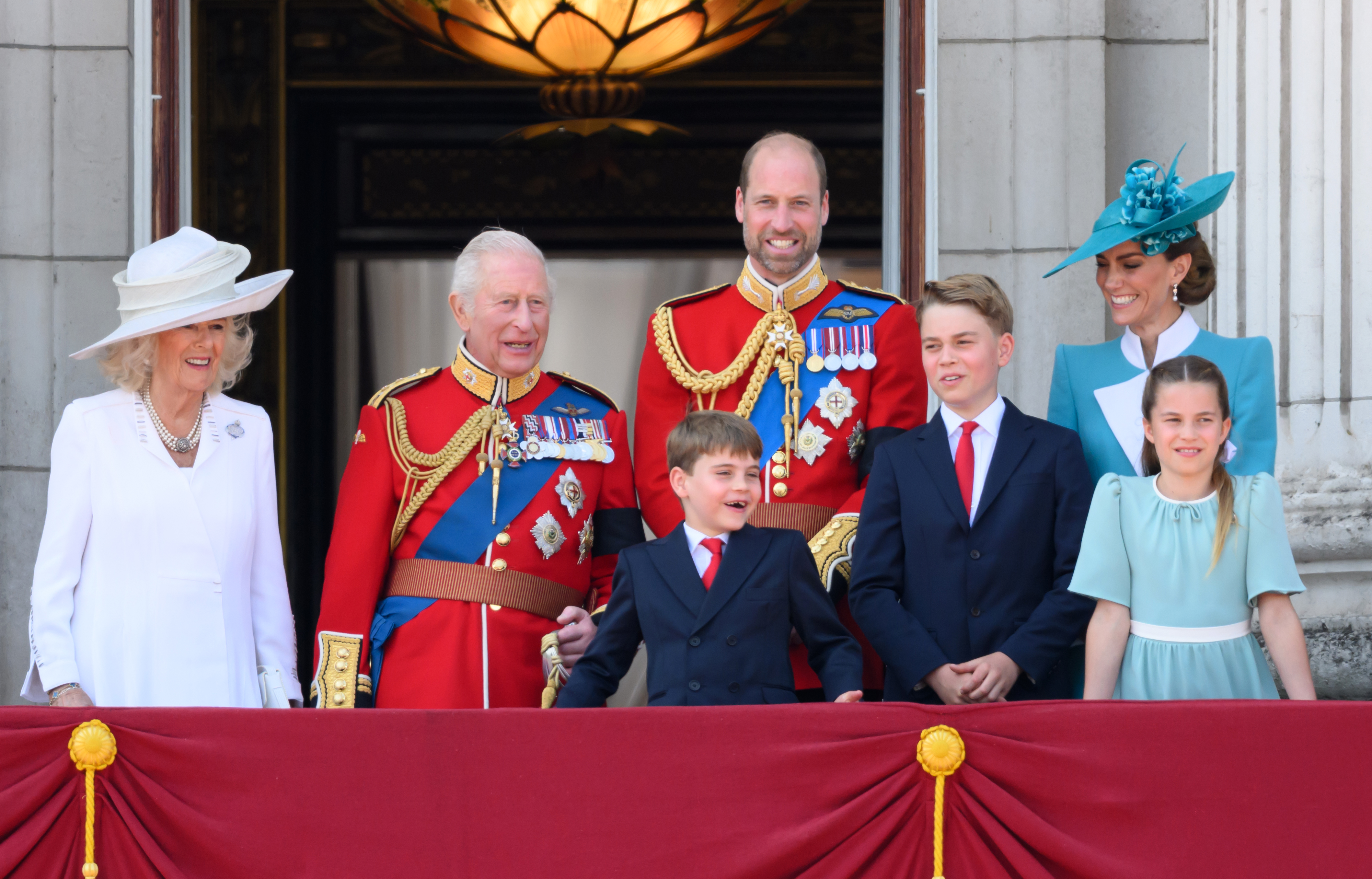 Queen Camilla and King Charles with the Wales family on the Buckingham Palace balcony