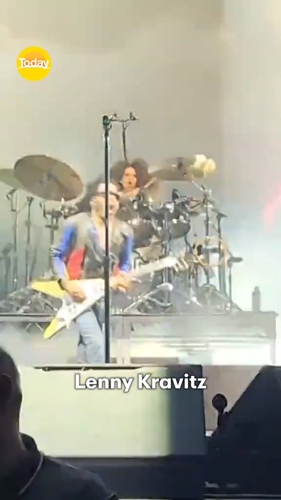 A concertgoer pulls out four of Lenny Kravitz’s dreadlocks when he does a walk through at his show in Brisbane