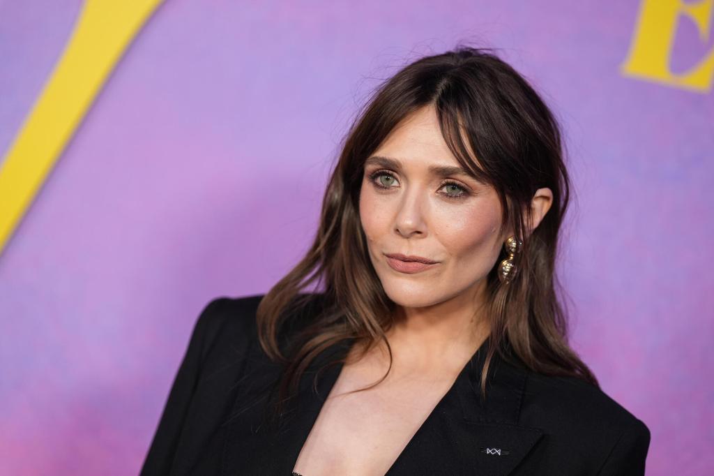 See Elizabeth Olsen’s Plunging & Daring Look for Eternity Premiere