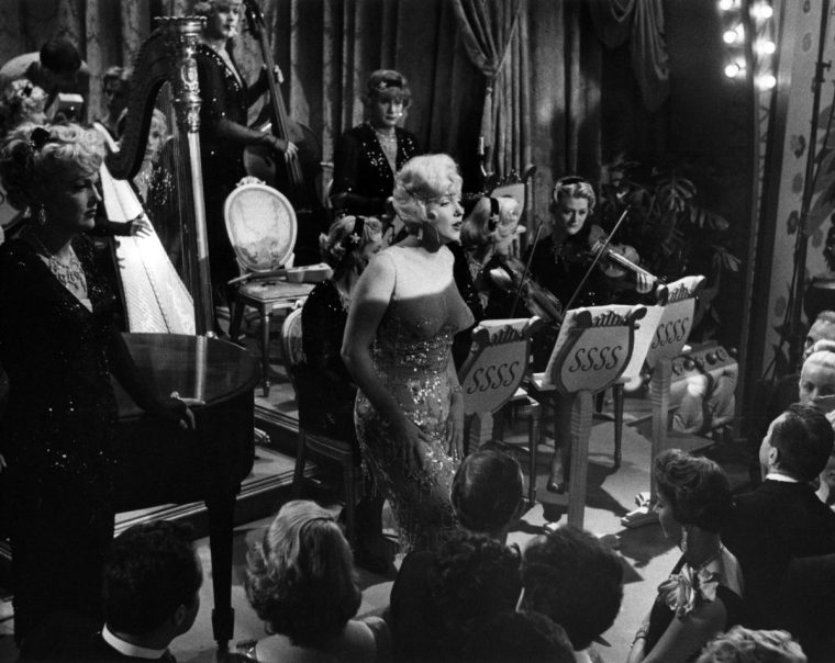 Marilyn Monroe with Tony Curtis and Jack Lemmon in drag in a scene from the movie "Some Like It Hot" in Los Angeles (Photo by Richard C. Miller/Getty Images)