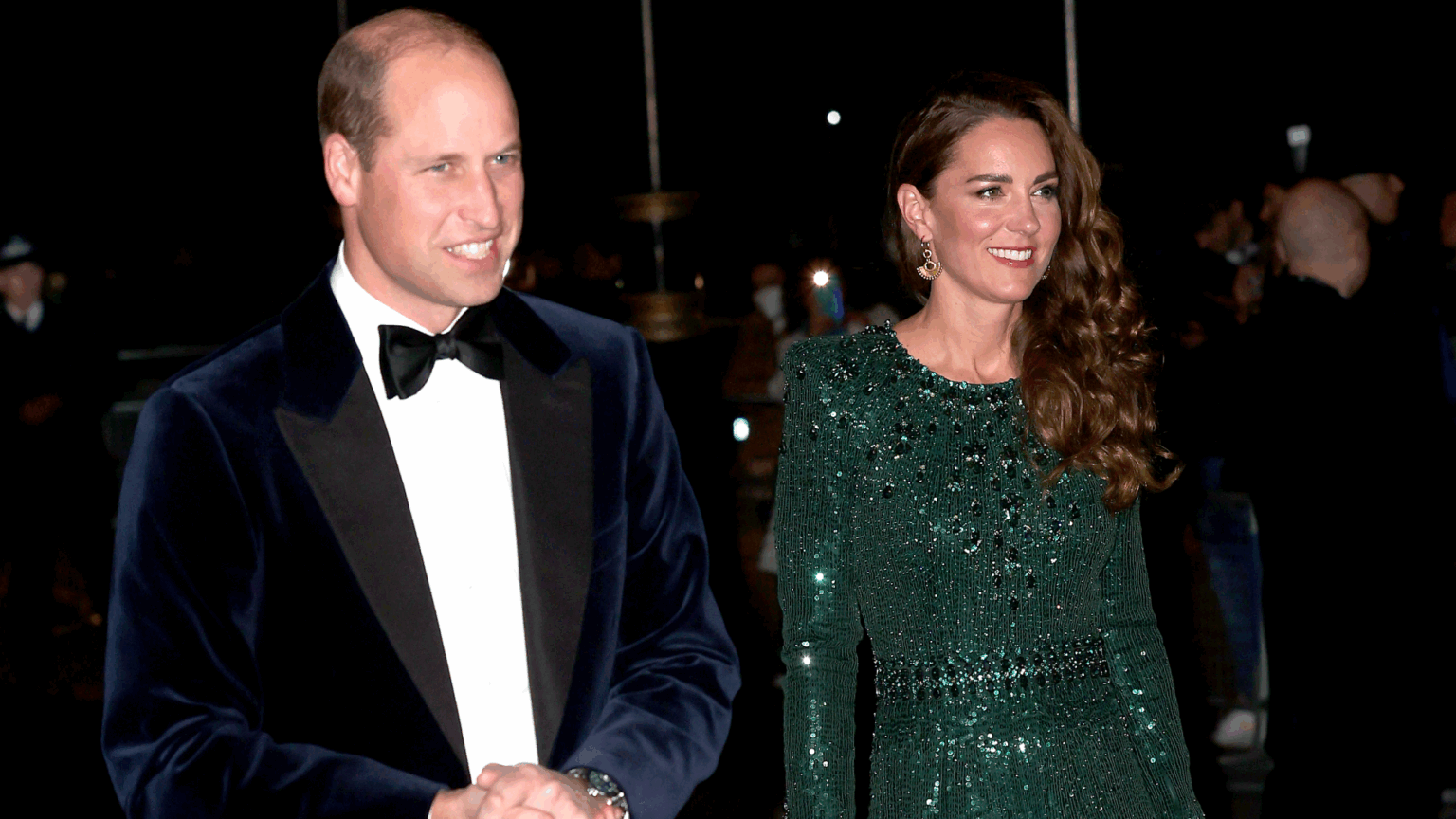 Prince William and Princess Kate Will Attend This Star-Studded Black Tie Event for the First Time Since Her Cancer Diagnosis Kate Middleton wearing a green beaded gown walking next to Prince William in a tux