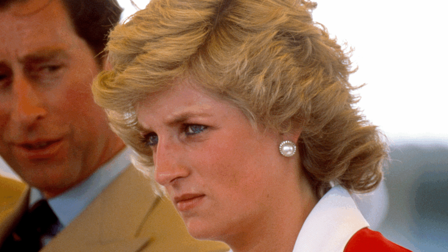 Holistic Healer Says Princess Diana Emitted “Flashes of Intense Anger” and “Extreme Sadness” Princess Diana wearing a red and white dress and scowling